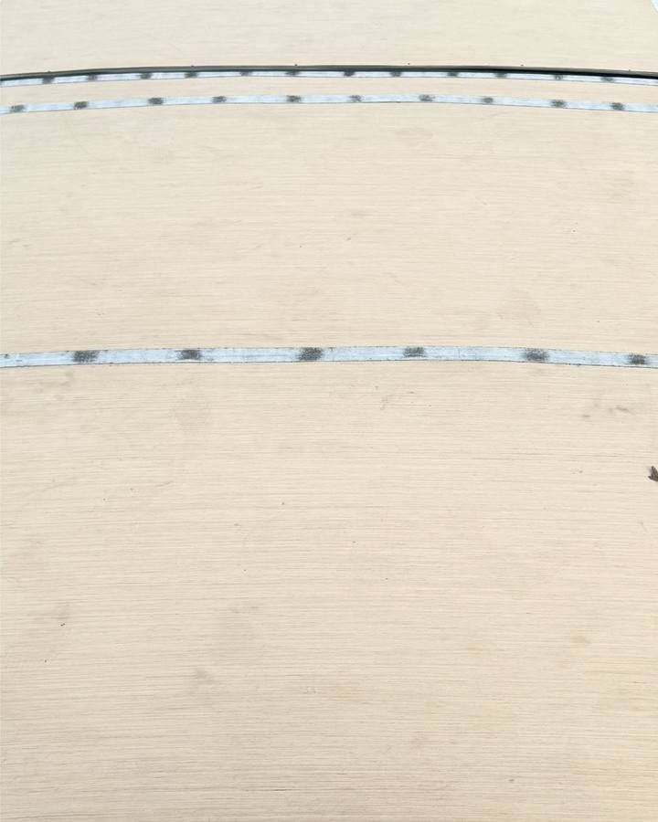 Rebuilt RV roof deck with new boards and proprietary reinforced sealant at the seams